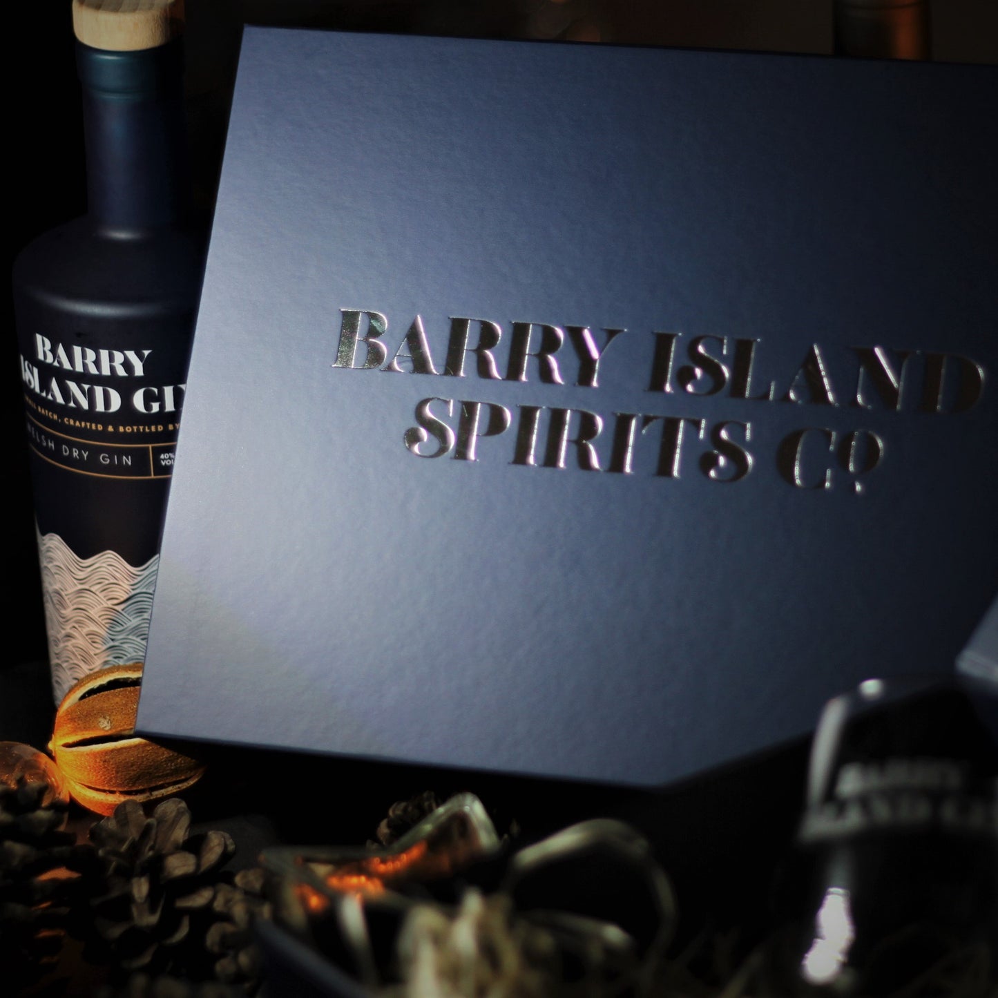 Barry Island Spirits Hamper box and a bottle of Barry Island gin in a Christmas setting