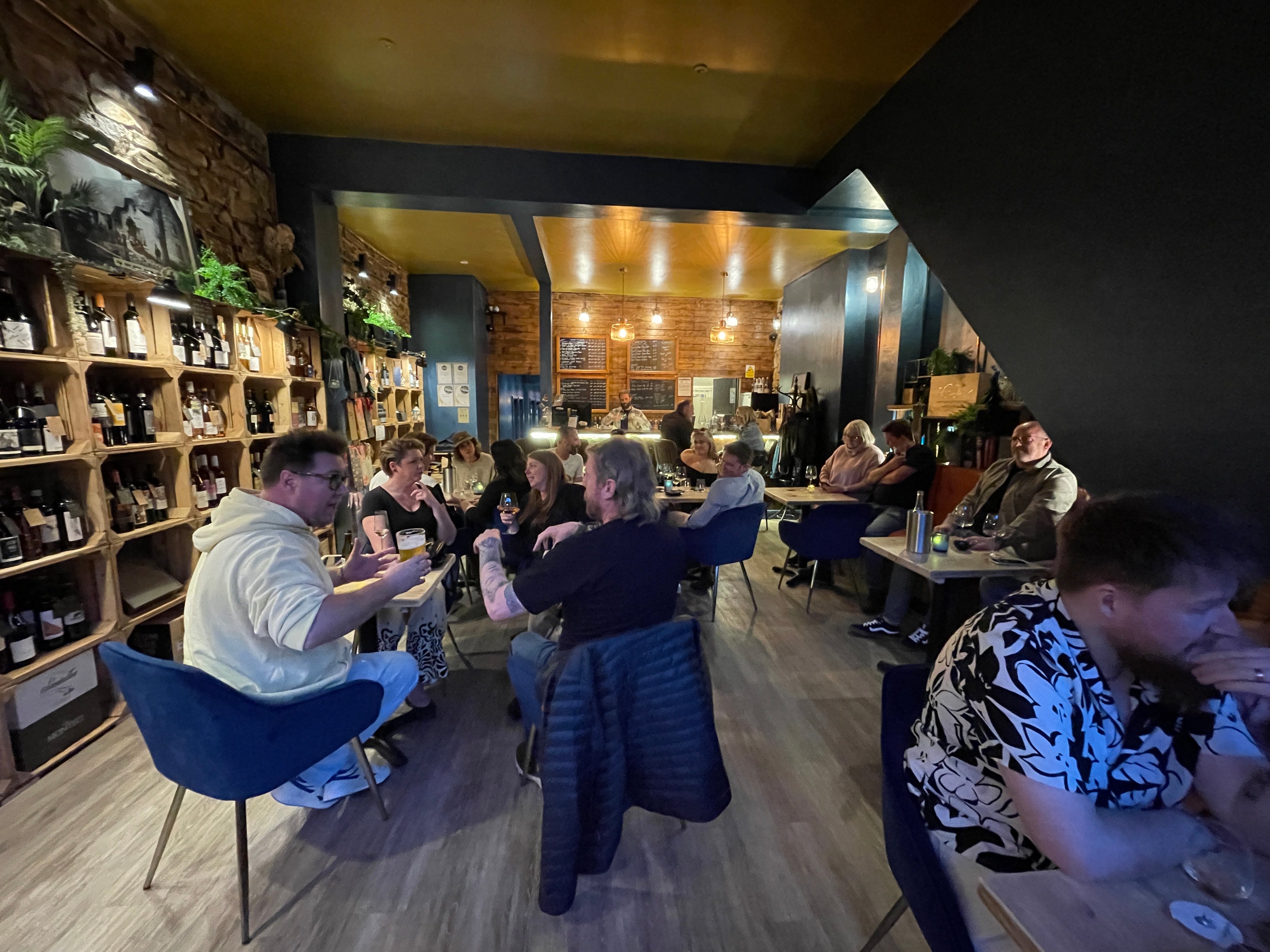 People drinking wine inside Mor bar on high Street, Barry