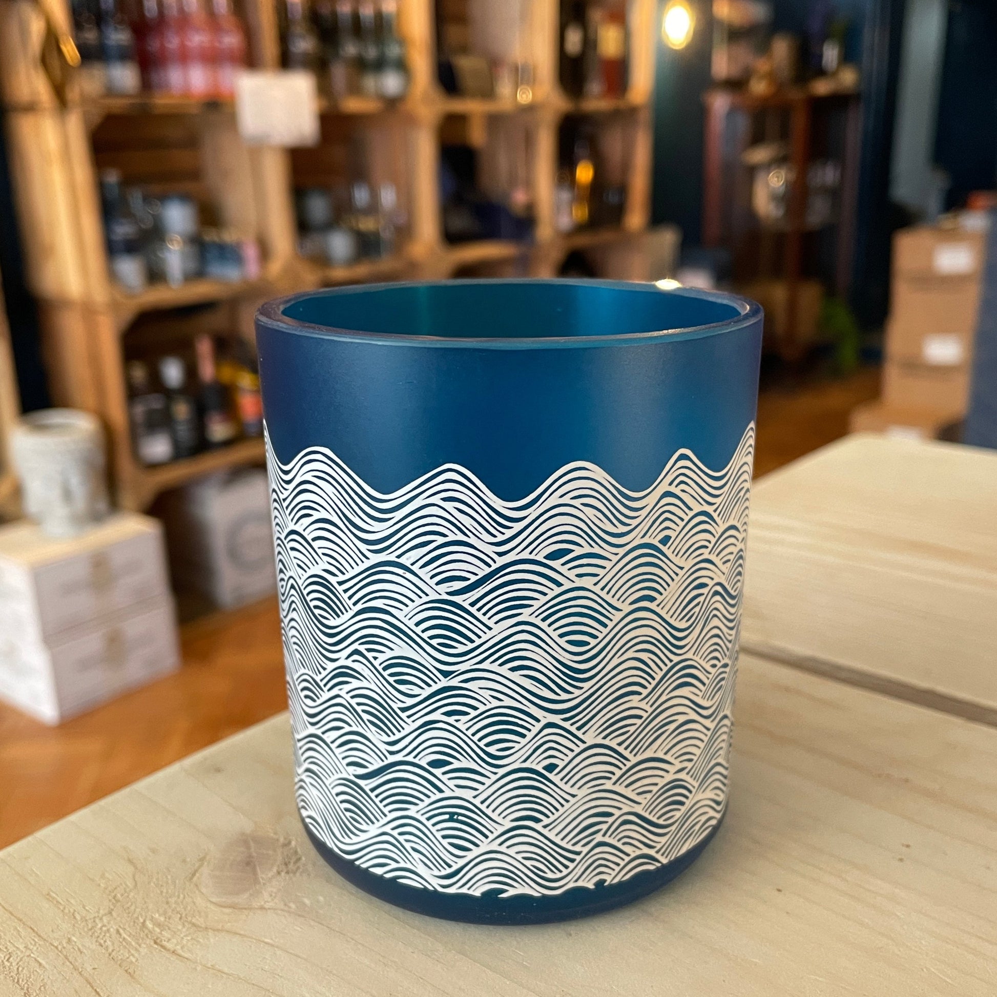 An upcycled Barry Island Gin Glass on a table