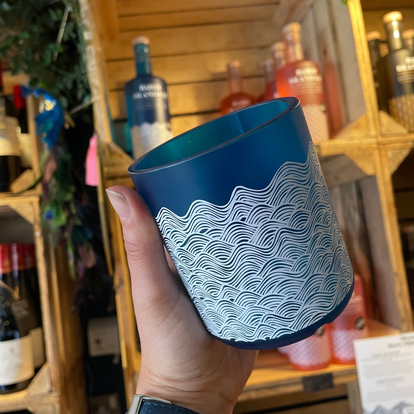 An upcycled Barry Island Gin Glass on a table